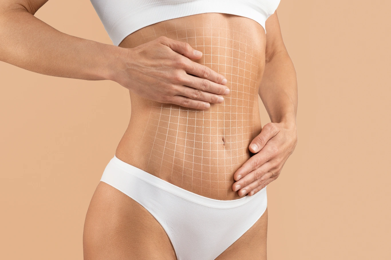 woman smooth lower abdomen profile Woman touching flat abdomen with grid pattern, highlighting skin treatment area